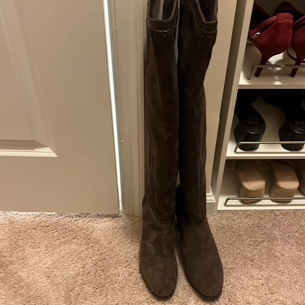 Brown knee high boots in suede material with high heels. Never worn